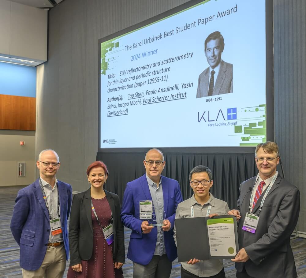 KLA's John Robinson presents Karel Urbánek Best Student Paper Award at the 2024 SPIE Advanced Lithography + Patterning Symposium.
